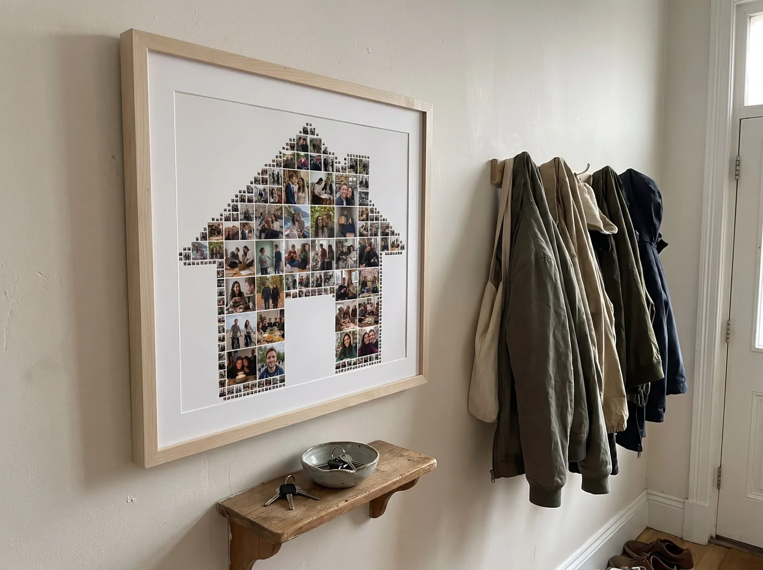 The house photo collage in a birch frame above an entryway key shelf