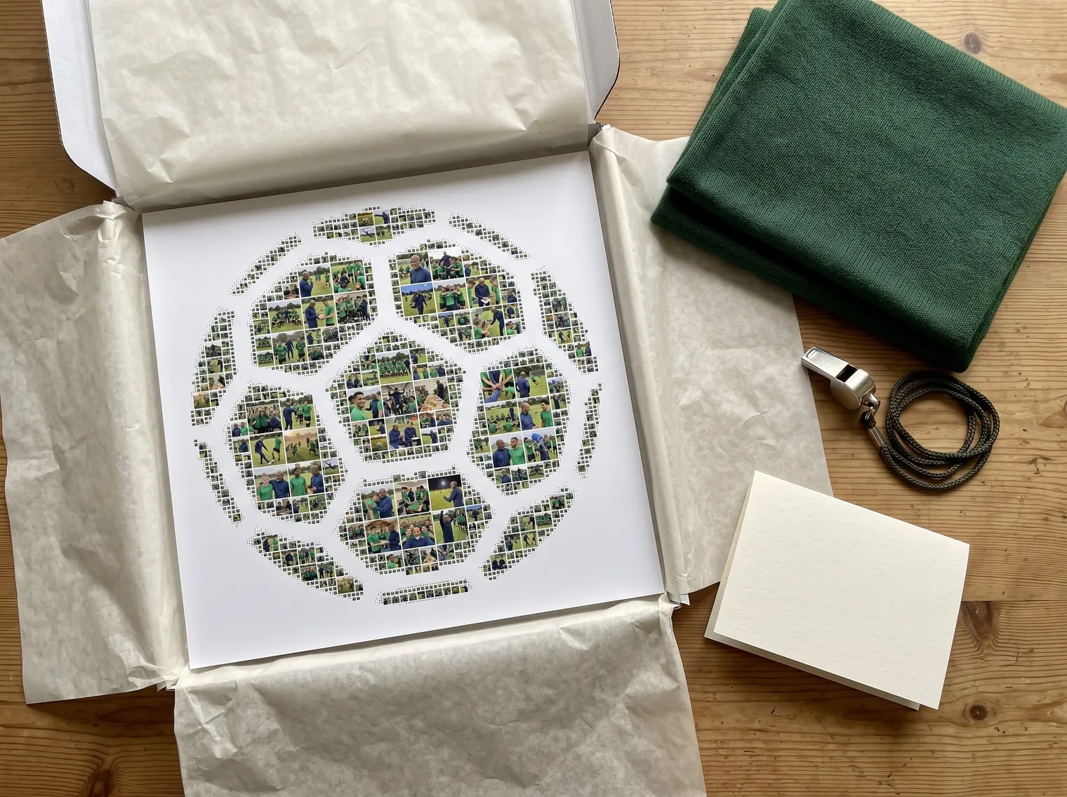 Soccer-ball photo collage print in an open white gift box with tissue paper, a whistle, a green scarf and a blank card