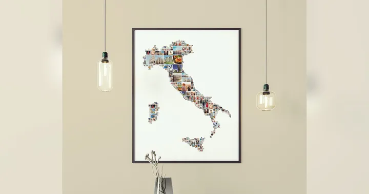 A framed photo collage print of the map of Italy, made from many small pictures, hanging as wall art in a stylish room.